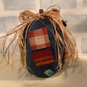 Denim wrapped pumpkin with patches and raffia bow. 
8.5” tall 
6” wide